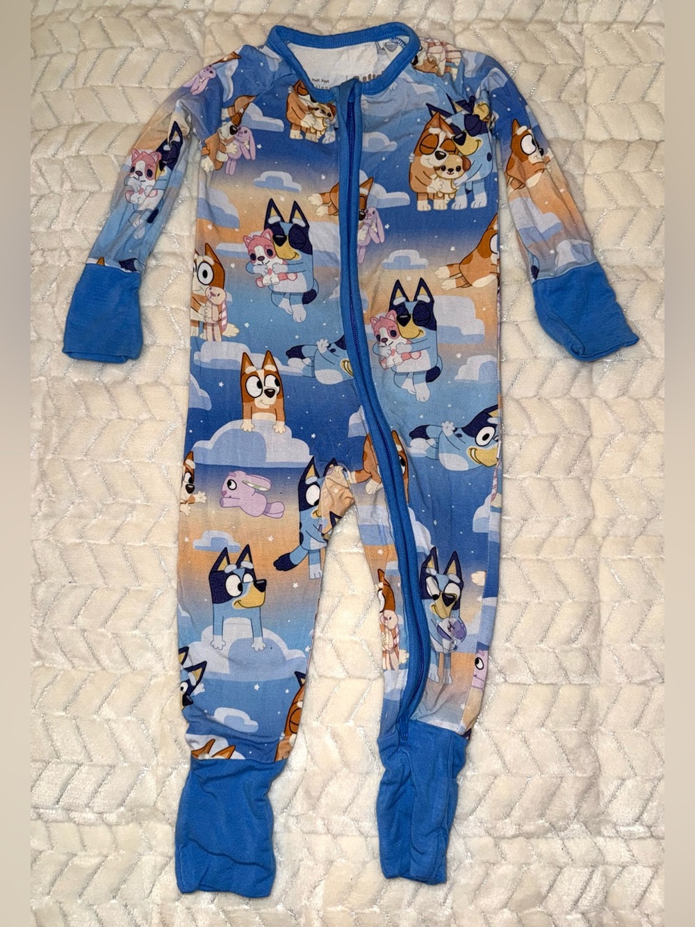 Bluey x Little Sleepies zippy in a light blue cloud print, size 3-6 months